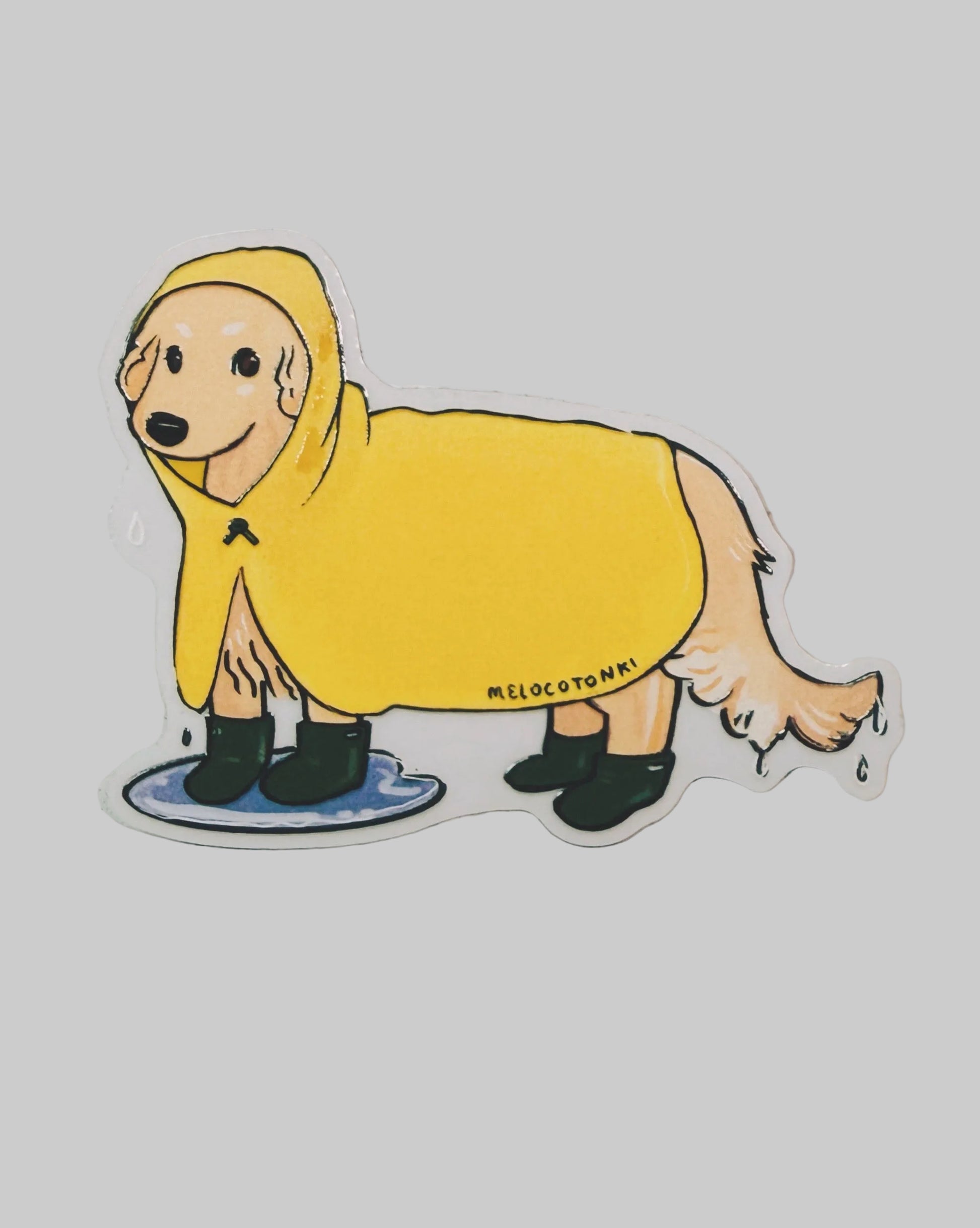 Sticker of a dog in a yellow raincoat with 'Melocotoni' branding on a light gray background.